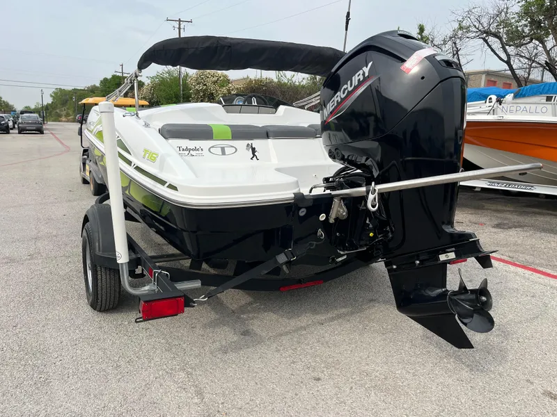 Slide: The Image of 2021 Tahoe T16 boat with Mercury engine on trailer, parked outdoors. - 6