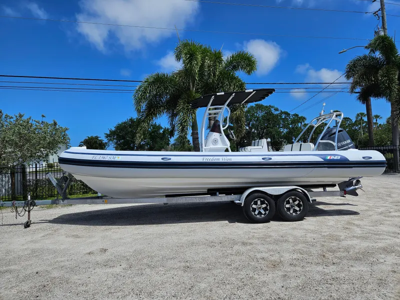 The Image of 2020 AB Inflatables Oceanus 24VST boat on trailer, parked outdoors under blue sky. - 1