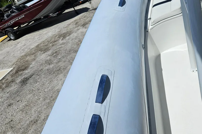 Slide: The Image of 2020 AB Inflatables Oceanus 24VST boat, close-up of inflatable side and interior. - 10
