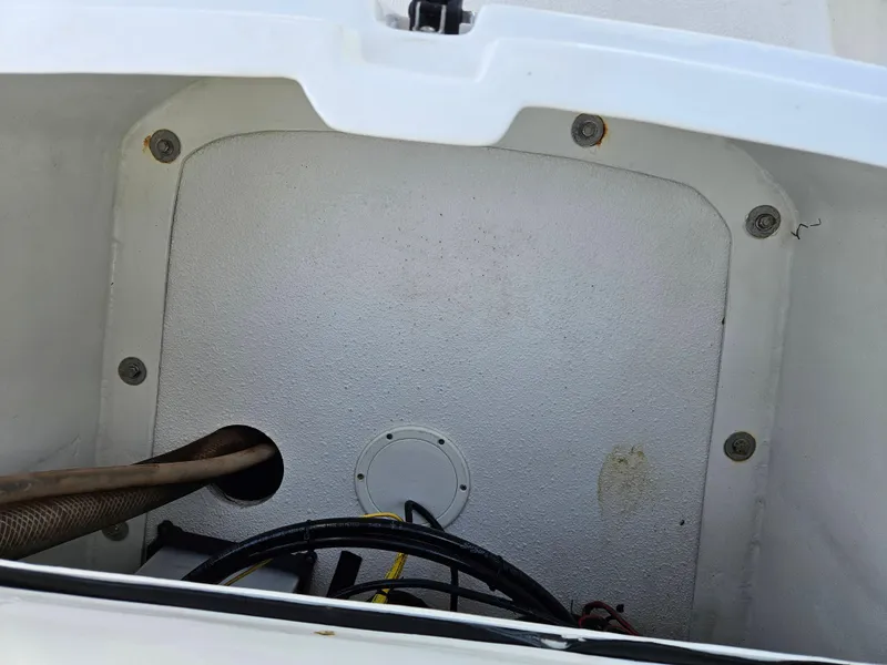 Slide: The Image of Storage compartment of 2020 AB Inflatables Oceanus 24VST boat, showing cables and hose. - 13