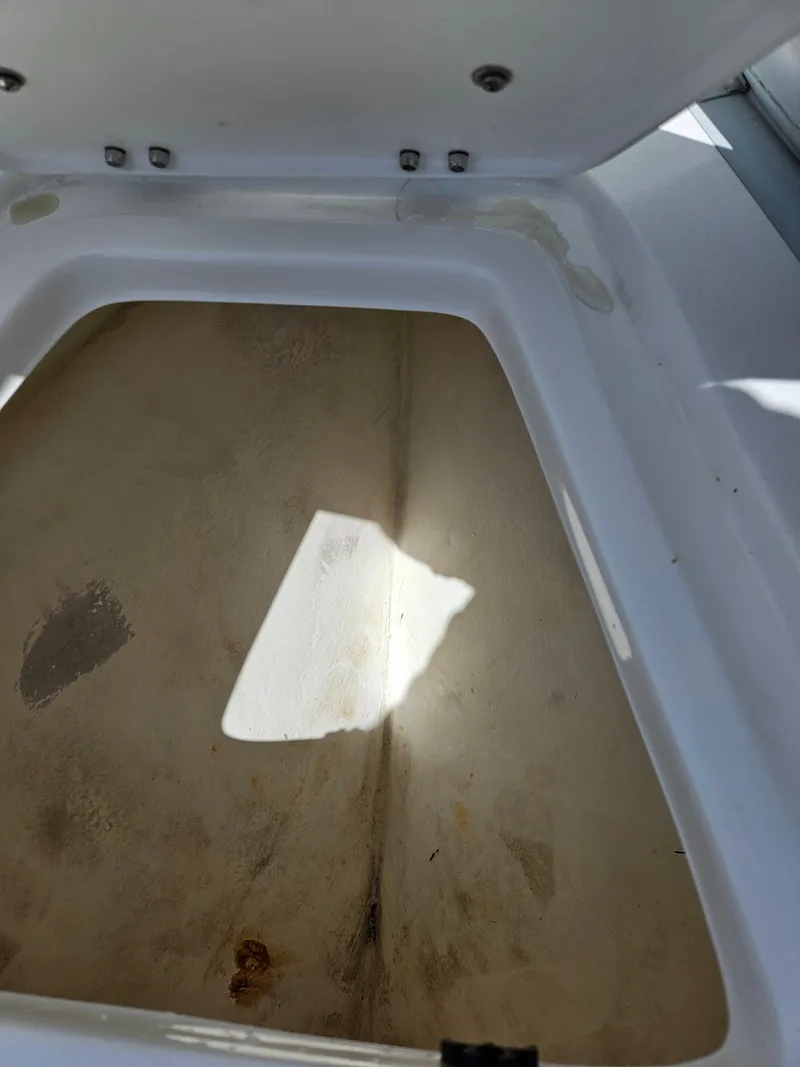 Slide: The Image of Storage compartment of 2020 AB Inflatables Oceanus 24VST boat, open lid, interior view. - 16