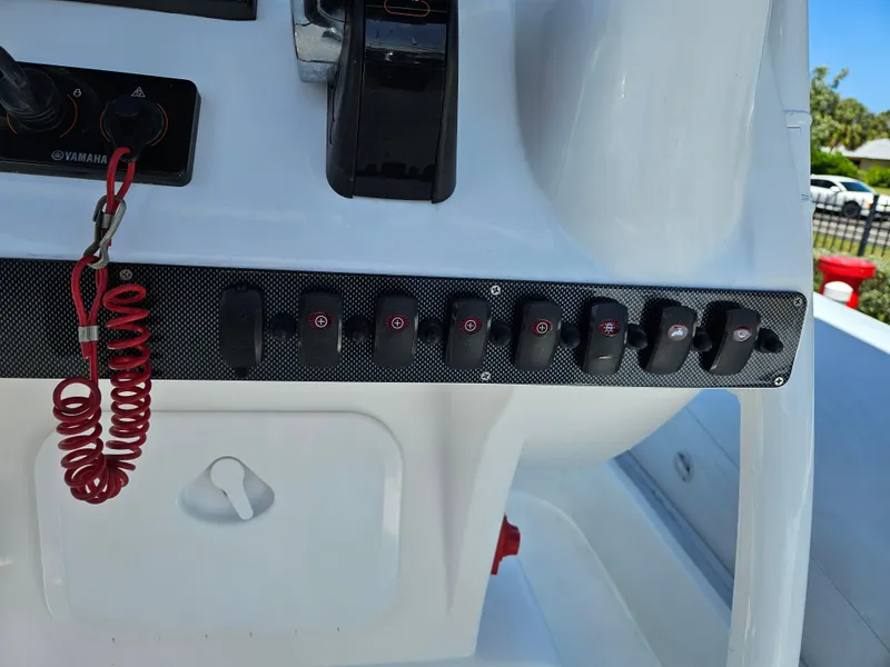 Slide: The Image of Control panel of 2020 AB Inflatables Oceanus 24VST boat with switches and safety cord. - 21