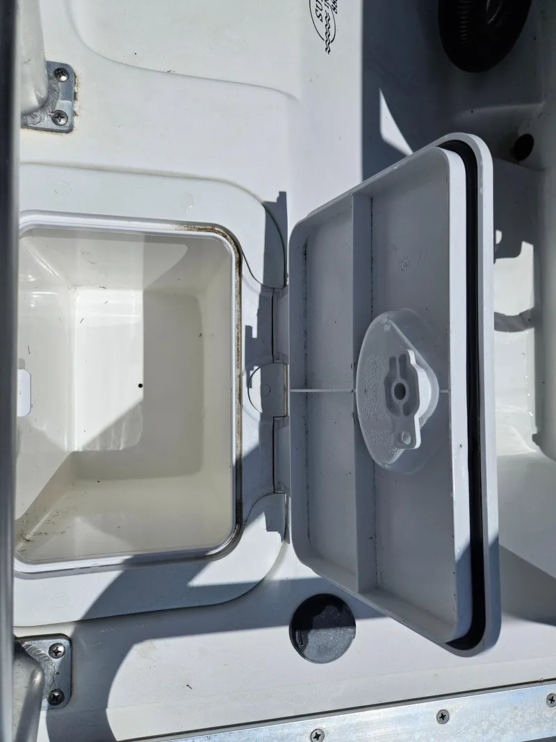 Slide: The Image of Open storage compartment on 2020 AB Inflatables Oceanus 24VST boat. - 25