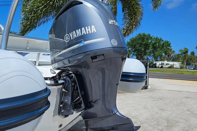Slide: The Image of 2020 AB Inflatables Oceanus 24VST with Yamaha 250 outboard motor, parked outdoors. - 28