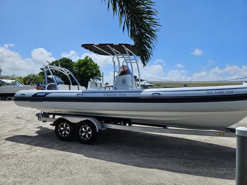 Slide: The Image of 2020 AB Inflatables Oceanus 24VST boat on trailer under clear sky. - 5