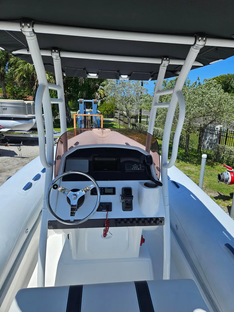 Slide: The Image of 2020 AB Inflatables Oceanus 24VST boat with steering console and canopy. - 7