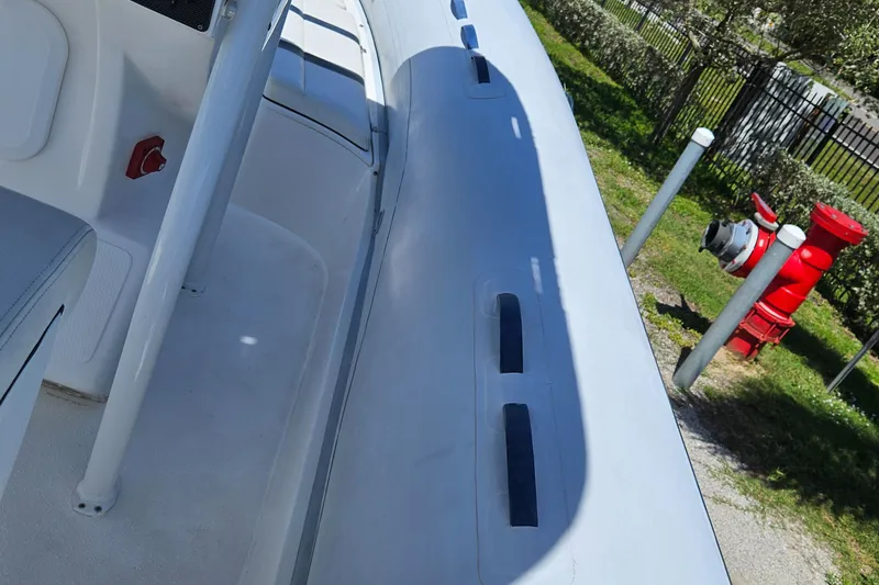 Slide: The Image of 2020 AB Inflatables Oceanus 24VST boat seating with black and white upholstery. - 9