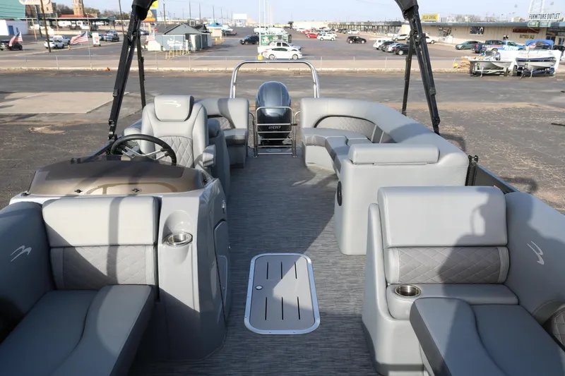 Slide: The Image of 2021 Bennington L22 pontoon boat interior with gray seating and modern design. - 10
