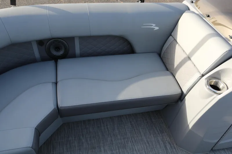 Slide: The Image of Luxurious seating on 2021 Bennington L22 pontoon boat with cup holder and speaker. - 24