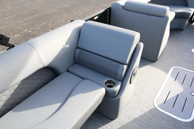 Slide: The Image of 2021 Bennington L22 boat interior with gray seating and cup holder. - 26