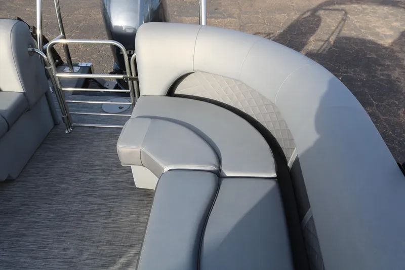 Slide: The Image of 2021 Bennington L22 pontoon boat with gray seating and stainless steel railing. - 29