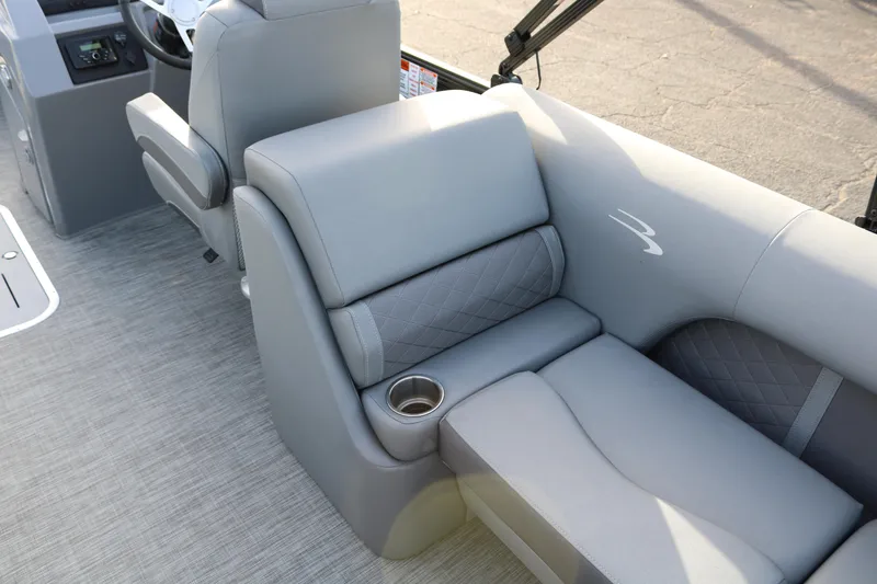 Slide: The Image of 2021 Bennington L22 boat interior with gray seating and cup holder. - 31