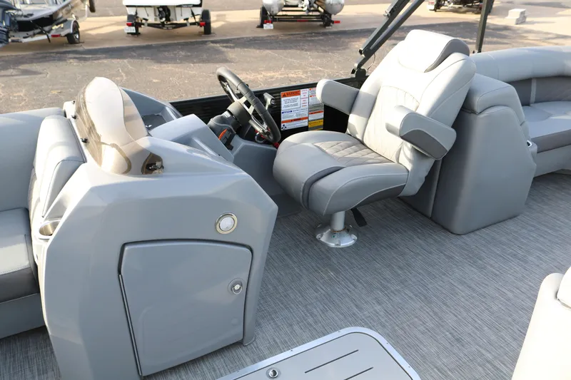 Slide: The Image of 2021 Bennington L22 boat interior with gray seating and steering console. - 37