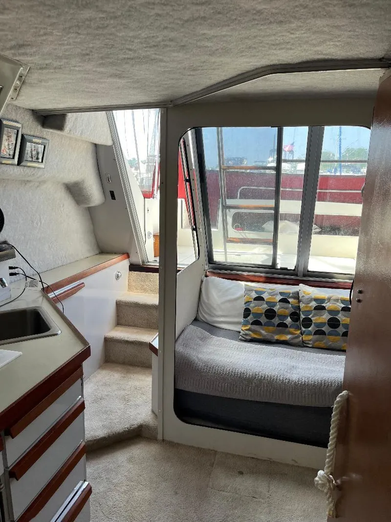 Slide: The Image of Interior of 1988 Carver 2767 Santego boat with cozy seating and nautical decor. - 29