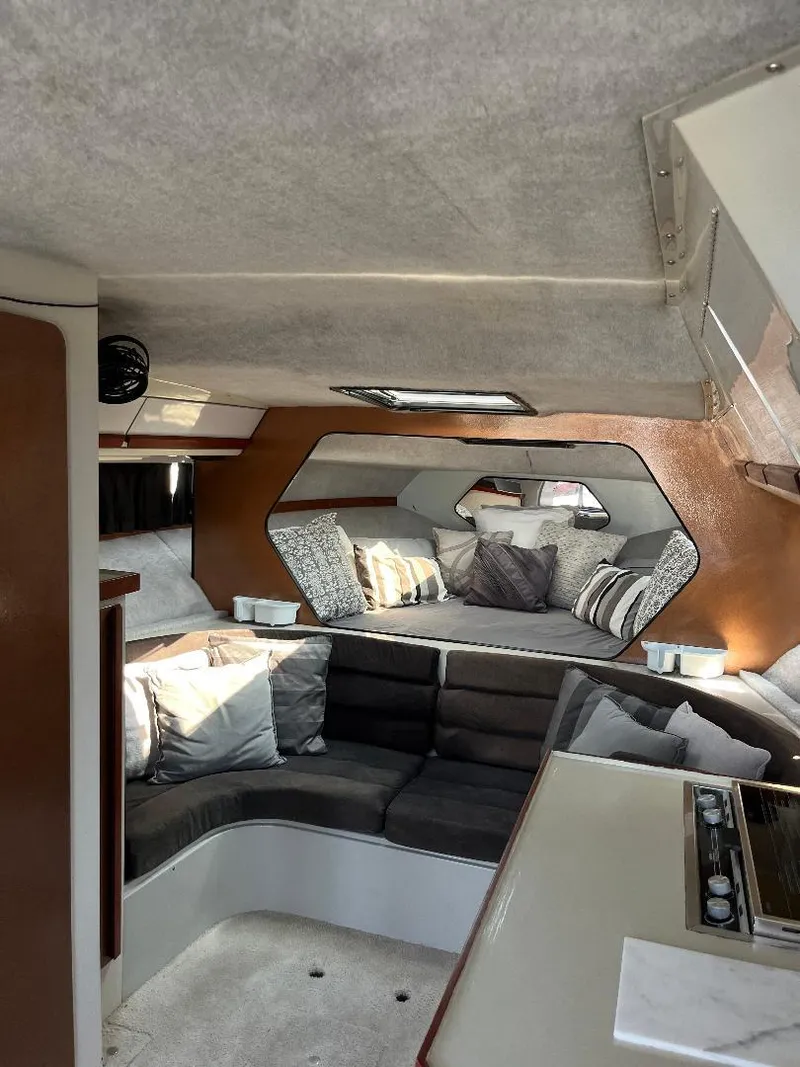 Slide: The Image of Interior of 1988 Carver 2767 Santego boat with cozy seating and modern design. - 3