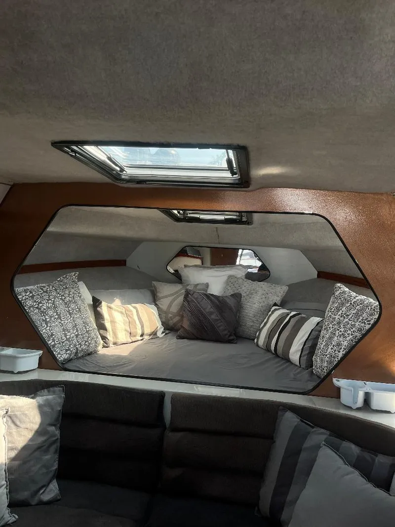 Slide: The Image of Interior of 1988 Carver 2767 Santego boat with cushions and skylight. - 8