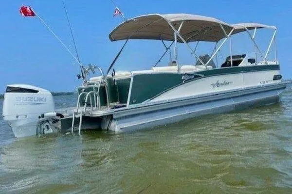 The Image of 2022 Avalon Catalina Platinum Quad Lounger boat on water with Suzuki outboard motor. - 0