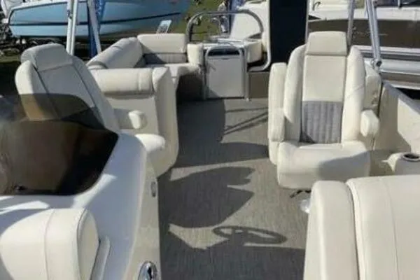 Slide: The Image of 2022 Avalon Catalina Platinum Quad Lounger boat interior with luxurious seating and modern design. - 4