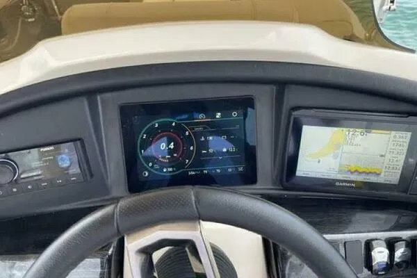 Slide: The Image of Dashboard of 2022 Avalon Catalina Platinum Quad Lounger with digital displays and controls. - 5