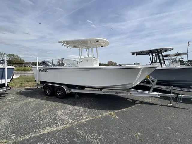Slide: The Image of 2025 Parker 23 SE boat on trailer, parked outdoors under cloudy sky. - 3