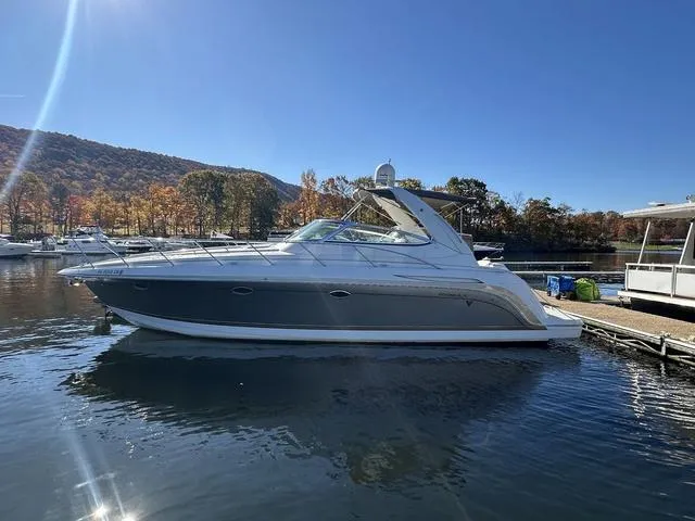 Slide: The Image of 2004 Formula 37PC yacht docked on a sunny day with scenic mountain backdrop. - 1