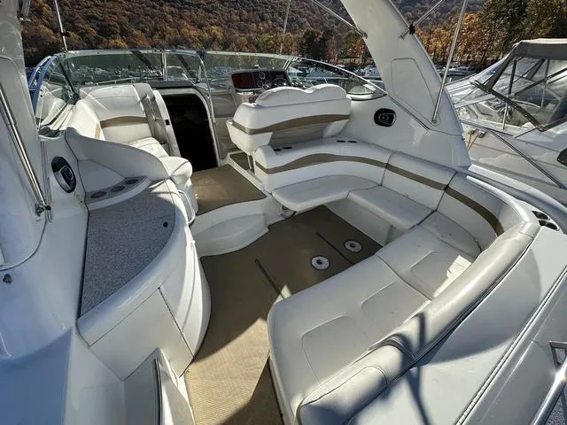Slide: The Image of 2004 Formula 37PC boat interior with white seating and open cockpit. - 10