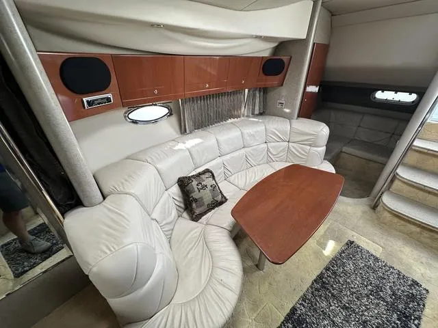 Slide: The Image of Luxurious interior of a 2004 Formula 37PC yacht with plush seating and wooden table. - 19