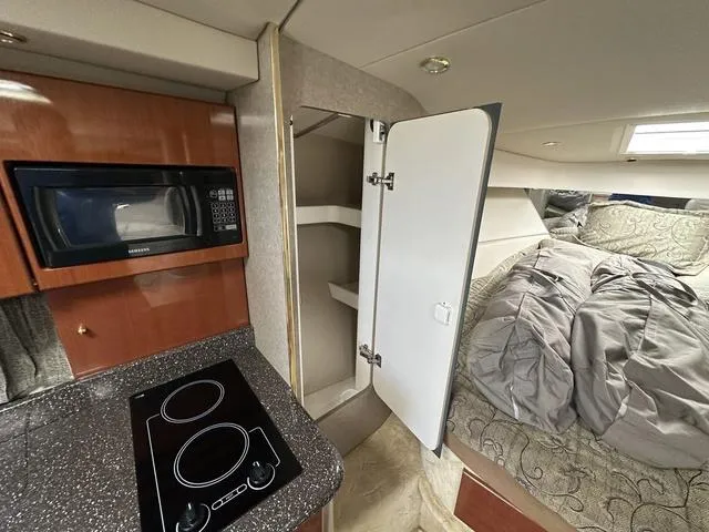Slide: The Image of Interior of 2004 Formula 37PC yacht with kitchen and cozy sleeping area. - 21