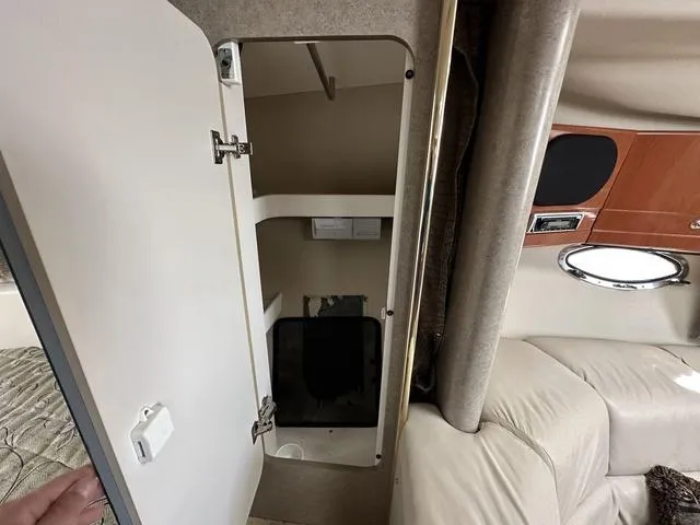 Slide: The Image of 2004 Formula 37PC interior showing open storage compartment and seating area. - 25