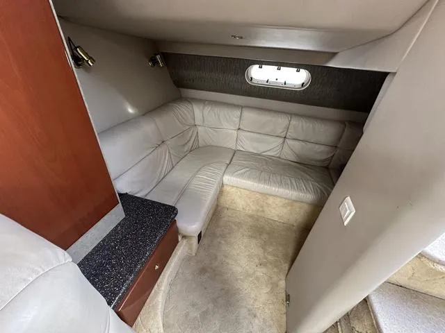 Slide: The Image of 2004 Formula 37PC yacht interior with beige leather seating and wood accents. - 27