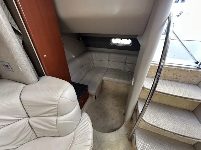 Slide: The Image of Interior of a 2004 Formula 37PC yacht with leather seating and carpeted flooring. - 28