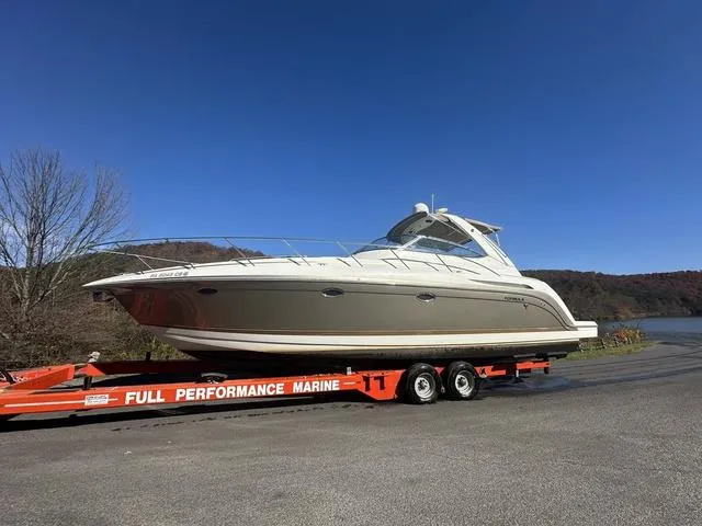 Slide: The Image of 2004 Formula 37PC yacht on trailer, clear sky, outdoor setting. - 3