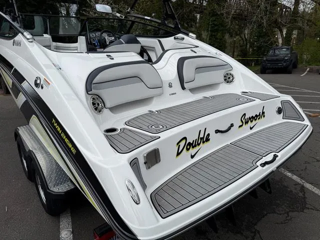 Slide: The Image of 2015 Yamaha Boats 212X speeding on a lake with passengers enjoying the ride. - 3