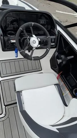 Slide: The Image of 2023 Yamaha Boats 195S cockpit with steering wheel and seating. - 5