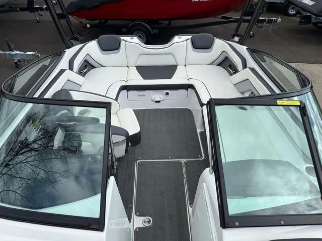 Slide: The Image of 2016 Yamaha Boats AR192 interior with white and gray seating, cup holder, and speaker. - 5