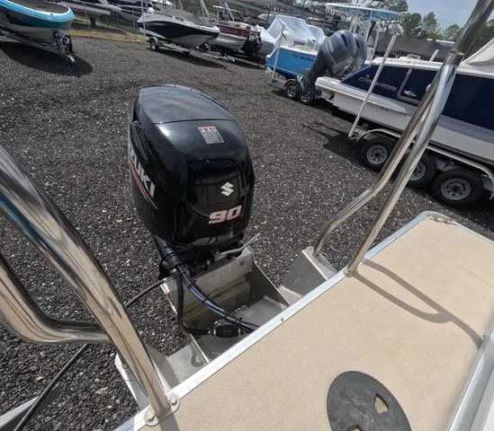 Slide: The Image of 2018 Sweetwater SW 2086 C boat with Suzuki 90 engine, parked on gravel lot. - 14