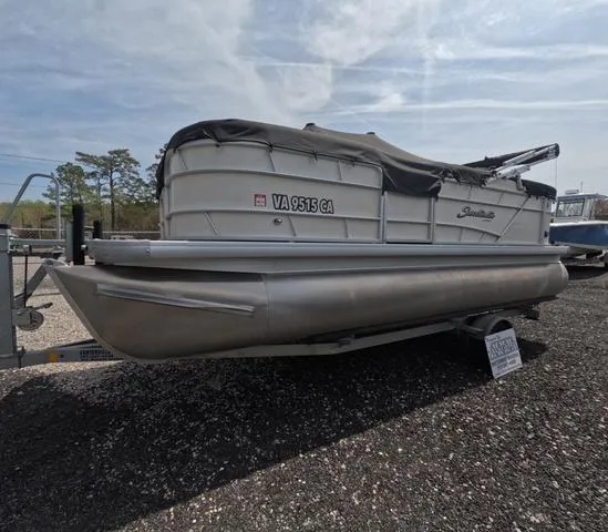 Slide: The Image of 2018 Sweetwater SW 2086 C pontoon boat with trailer, fresh water only, covered and parked. - 2