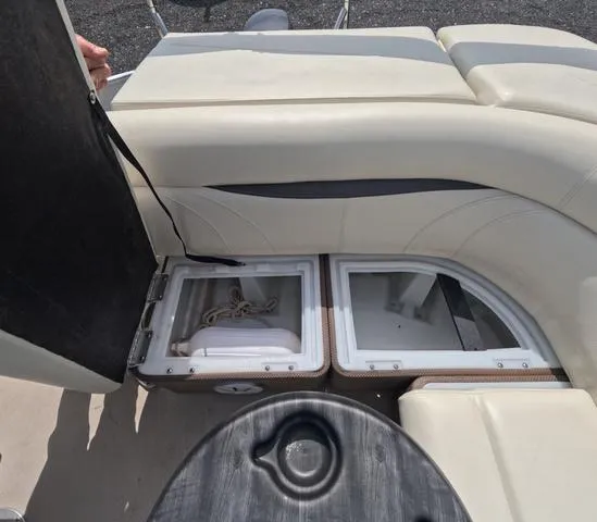 Slide: The Image of 2018 Sweetwater SW 2086 C boat interior with storage compartments and seating. - 22