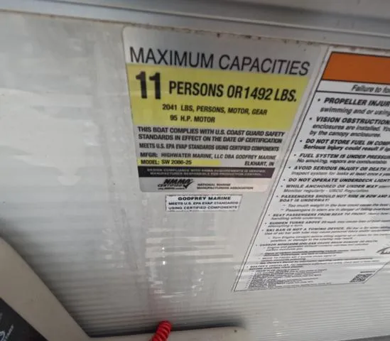 Slide: The Image of 2018 Sweetwater SW 2086 C capacity label: 11 persons or 1492 lbs, 85 HP motor. - 23