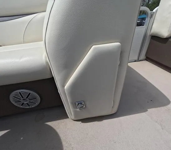 Slide: The Image of 2018 Sweetwater SW 2086 C boat interior with beige seating and speaker detail. - 25