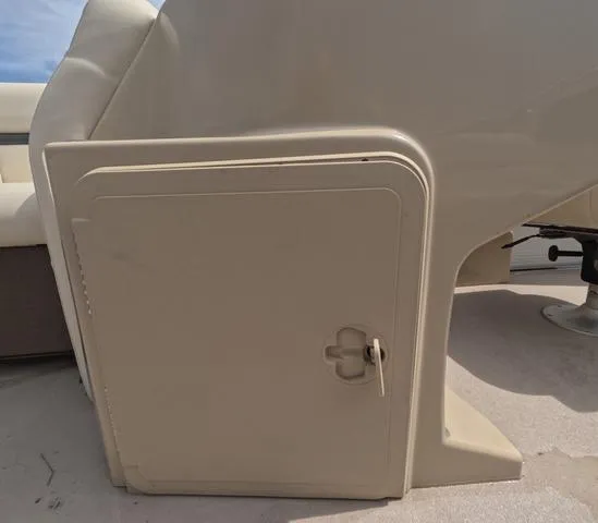 Slide: The Image of 2018 Sweetwater SW 2086 C boat interior storage compartment, beige color, fresh water use. - 27
