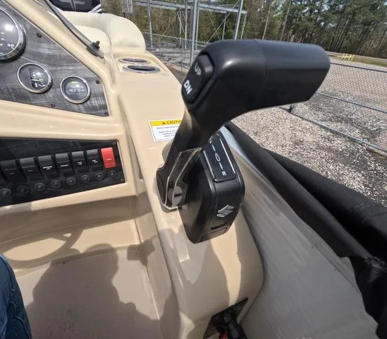 Slide: The Image of 2018 Sweetwater SW 2086 C boat control panel with throttle lever and gauges. - 30