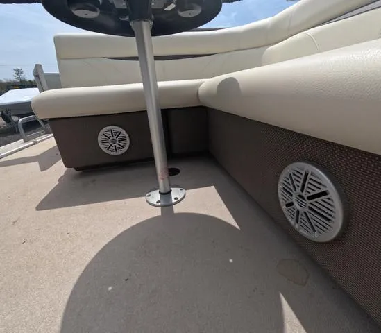 Slide: The Image of 2018 Sweetwater SW 2086 C boat interior with speakers and seating. - 44