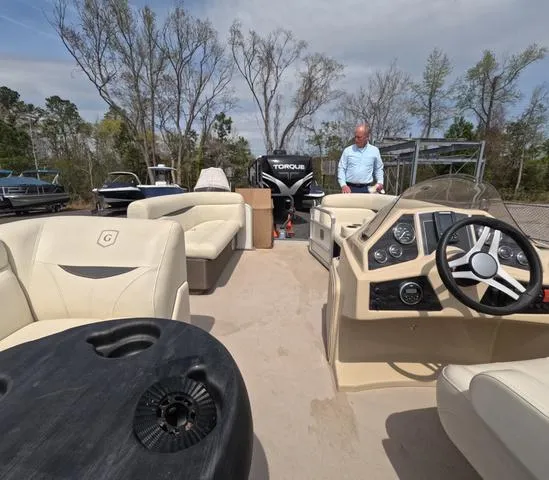 Slide: The Image of 2018 Sweetwater SW 2086 C pontoon boat with seating, steering console, and fresh water trailer. - 49