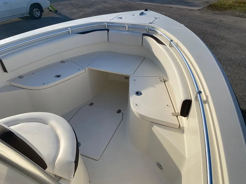 Slide: The Image of 2021 Cobia 237 Center Console boat interior with seating and storage compartments. - 10