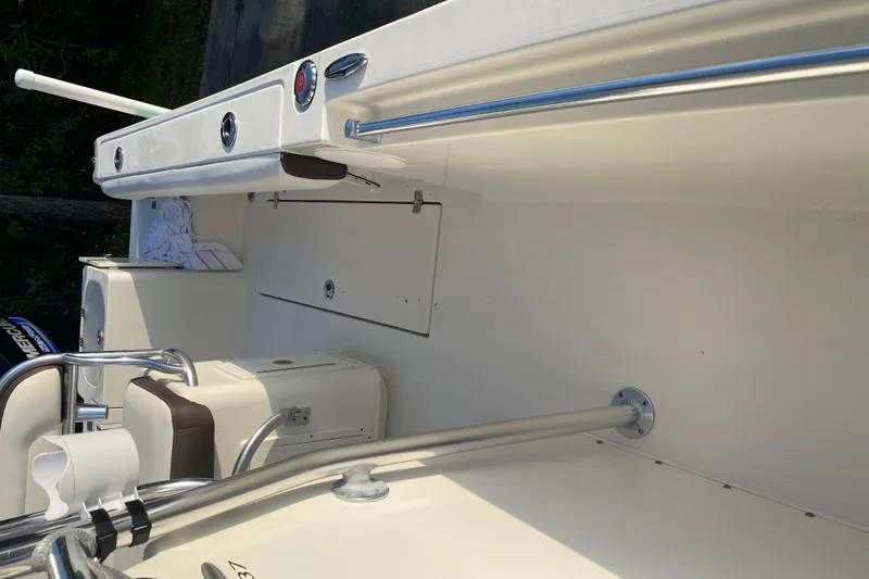 Slide: The Image of 2021 Cobia 237 Center Console boat interior with seating and storage features. - 16