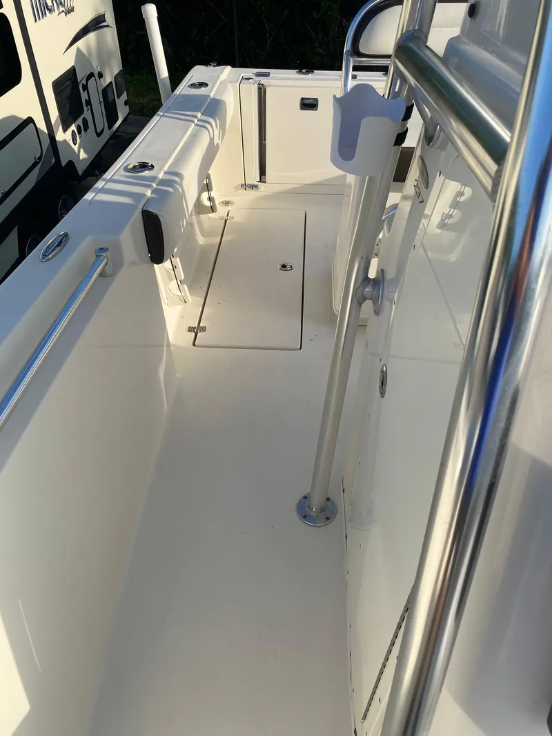 Slide: The Image of 2021 Cobia 237 Center Console boat deck with stainless steel railing. - 17