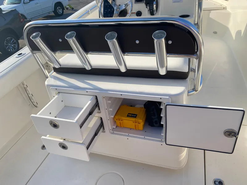 Slide: The Image of 2021 Cobia 237 Center Console boat storage with open drawers and compartments. - 26