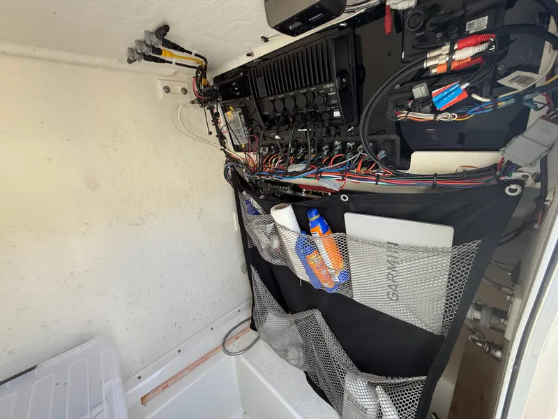 Slide: The Image of 2022 Parker 2801 Center Console boat wiring and storage compartment. - 16