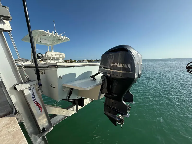 Slide: The Image of 2022 Parker 2801 Center Console boat with Yamaha outboard motor on a sunny day. - 4